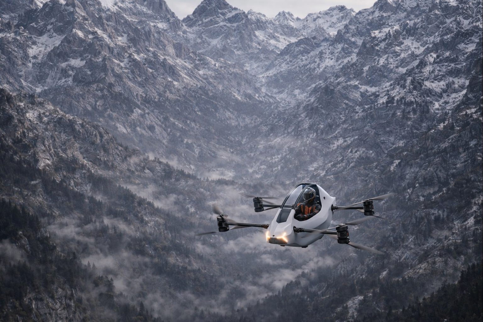 Fantom X aircraft flying over dramatic mountain landscape with snow-capped peaks